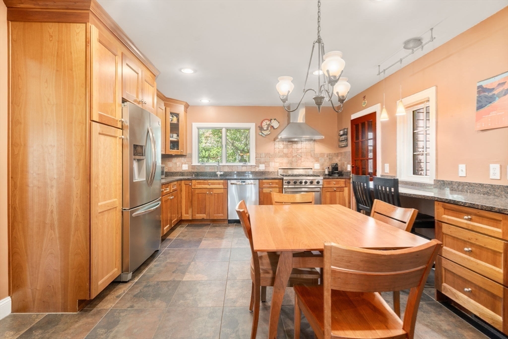 36 Blake Road Brookline, MA 02445 - Photo 14 of 34 a kitchen with stainless steel appliances granite countertop a sink a stove and a refrigerator