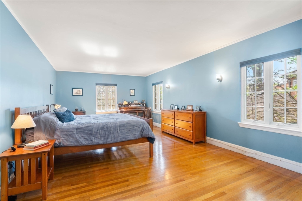 36 Blake Road Brookline, MA 02445 - Photo 23 of 34 a bedroom with furniture and a wooden floor