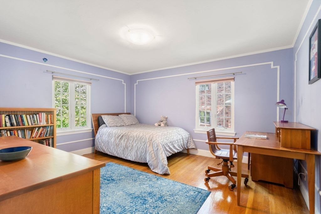 36 Blake Road Brookline, MA 02445 - Photo 25 of 34 a spacious bedroom with a bed and wooden floor