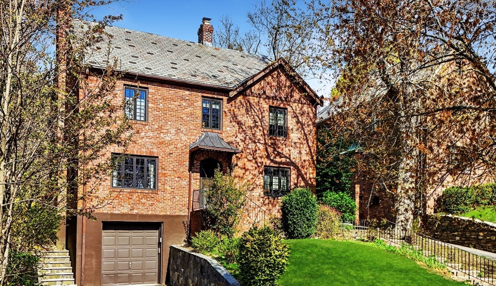 36 Blake Road Brookline, MA 02445 - Photo 29 of 34 a front view of a house with garden