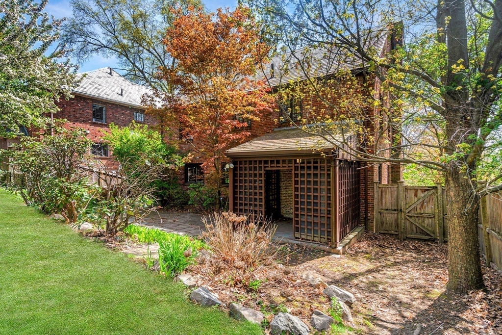 36 Blake Road Brookline, MA 02445 - Photo 32 of 34 a front view of a house with a yard