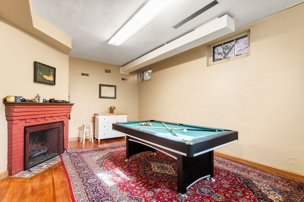36 Blake Road Brookline, MA 02445 - Photo 33 of 34 a living room with stainless steel appliances granite countertop furniture and a fireplace