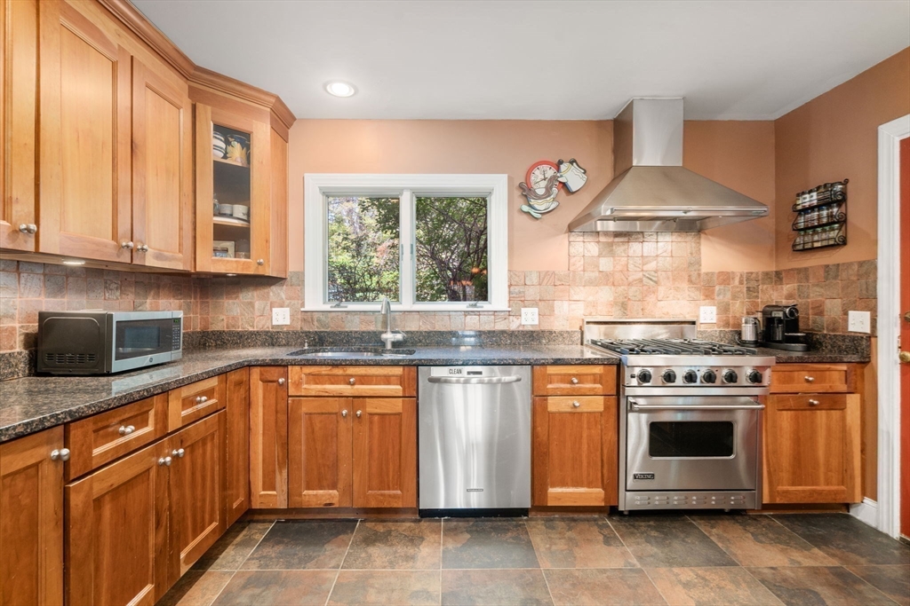 36 Blake Road Brookline, MA 02445 - Photo 5 of 34 a kitchen with stainless steel appliances granite countertop a stove and a sink