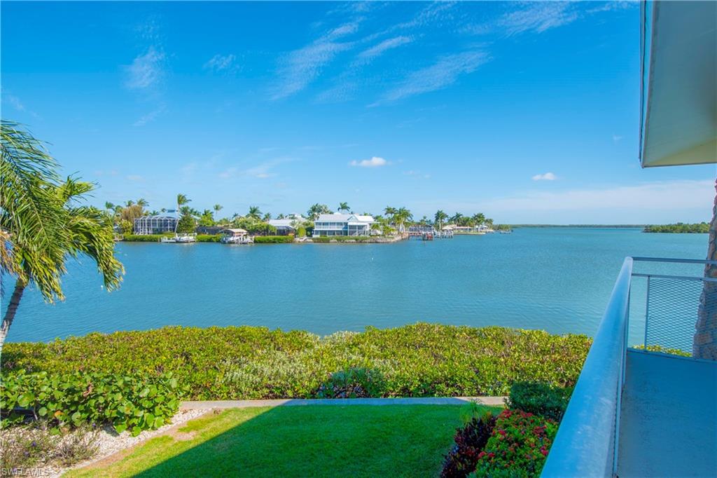 330 Kon Tiki Drive, Unit A2 Naples, FL 34113 - Photo 1 of 19 a view of a lake with a city view