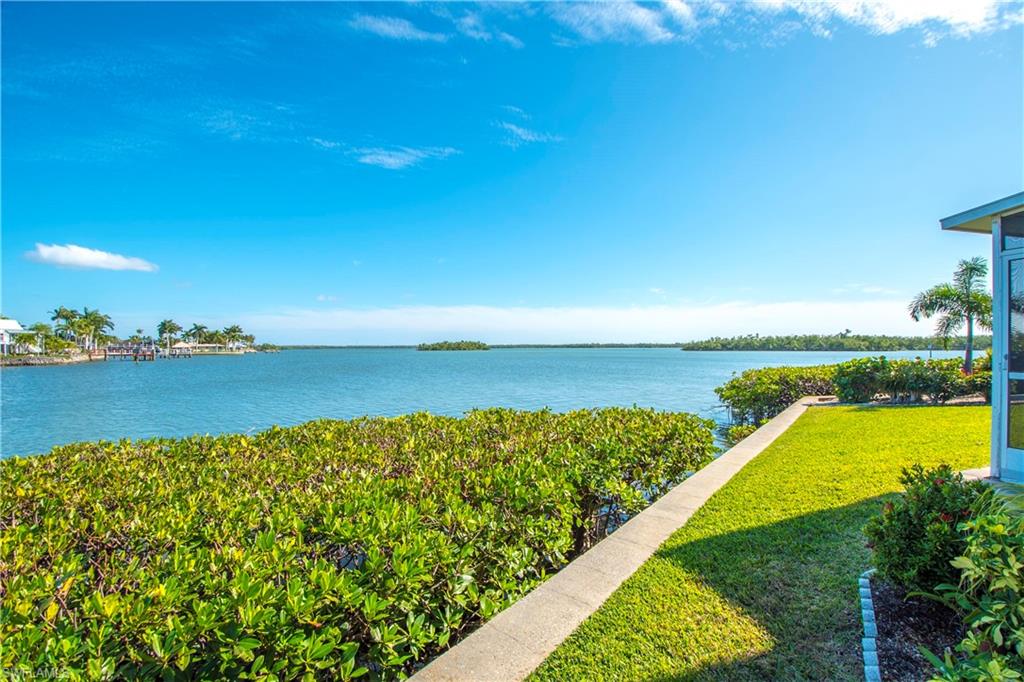 330 Kon Tiki Drive, Unit A2 Naples, FL 34113 - Photo 16 of 19 a view of an ocean from a balcony