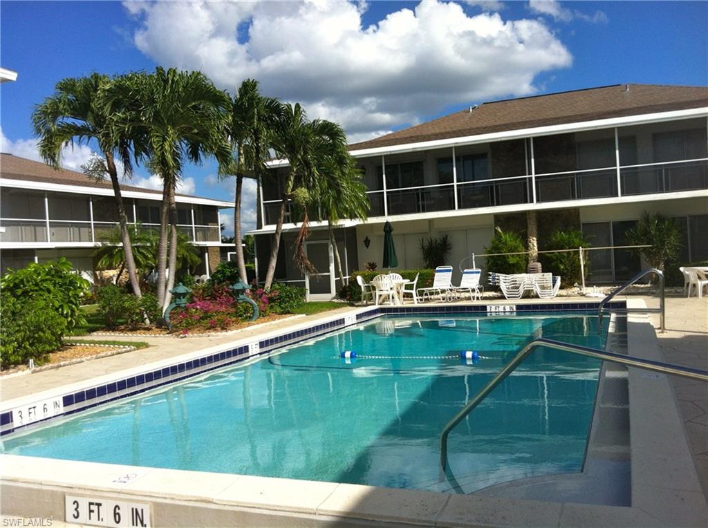 330 Kon Tiki Drive, Unit A2 Naples, FL 34113 - Photo 19 of 19 a view of a house with a swimming pool