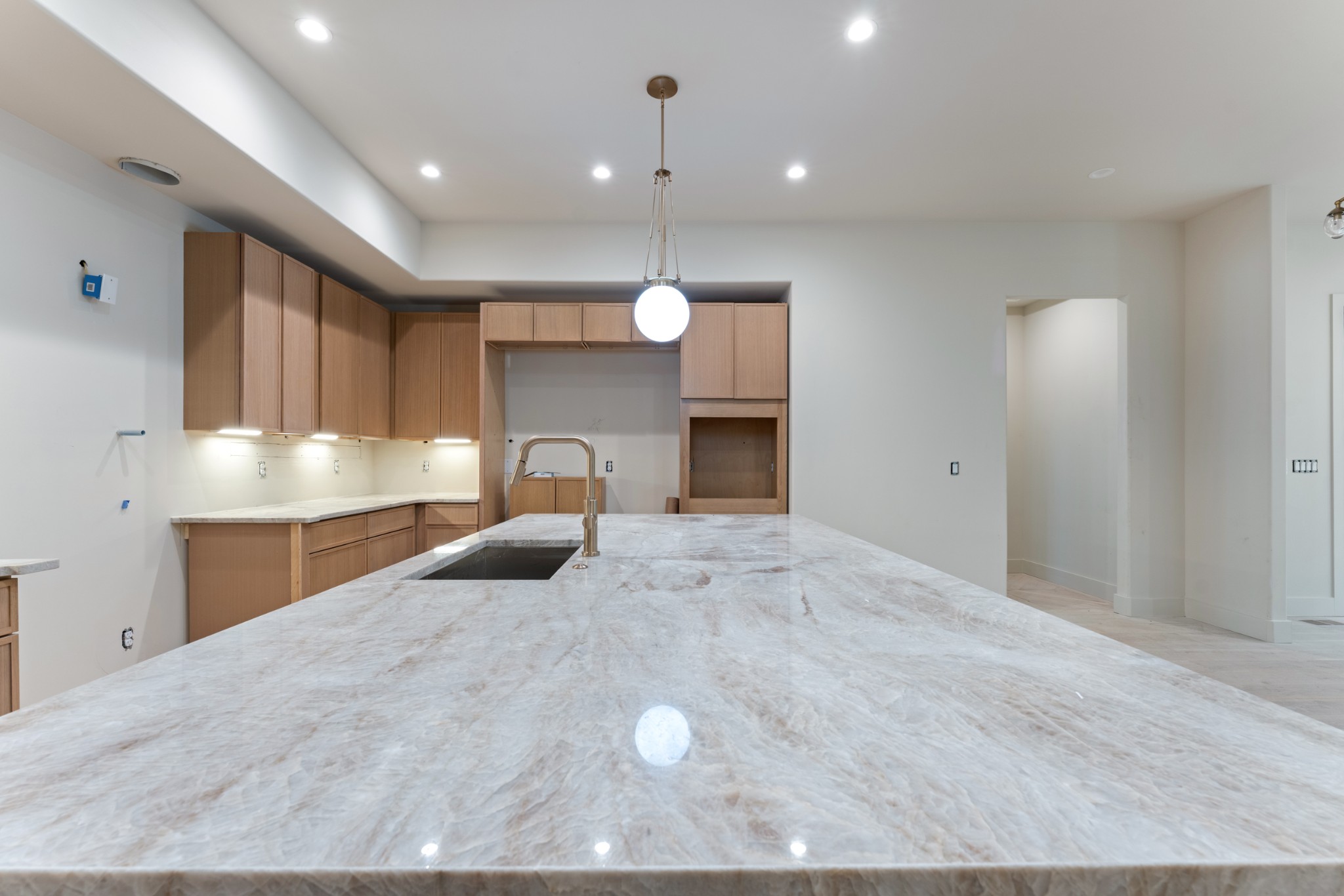 7678 Sawyer Brown Road Nashville, TN 37209 - Photo 15 of 77 a large kitchen with kitchen island granite countertop a stove a sink a refrigerator and a sink