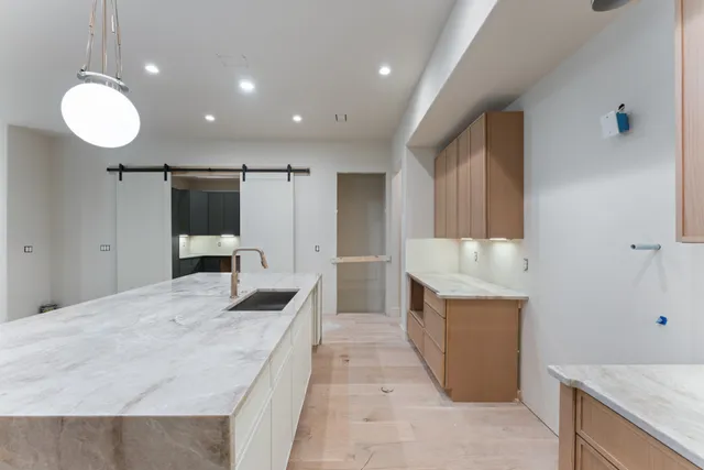a bathroom with a bathtub and shower