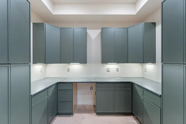 a spacious bathroom with a shower sink and mirror