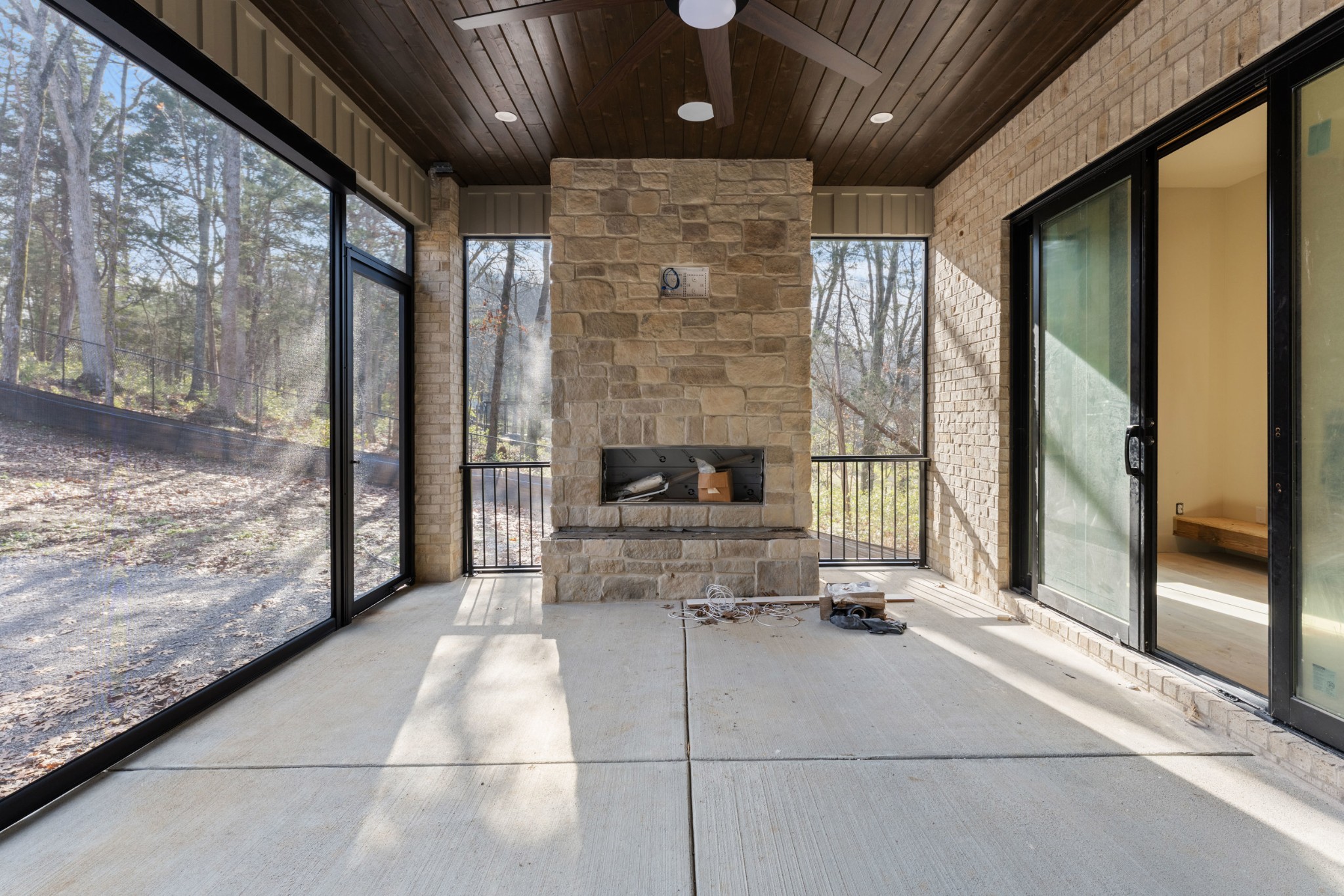 7678 Sawyer Brown Road Nashville, TN 37209 - Photo 18 of 77 a living room with a large fireplace and large windows