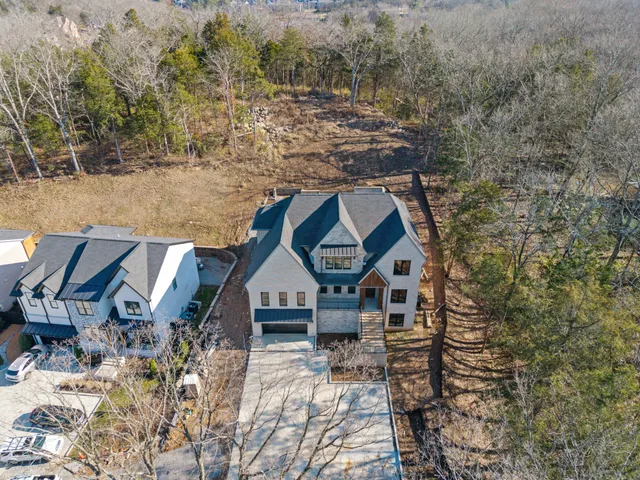a aerial view of a house with a yard