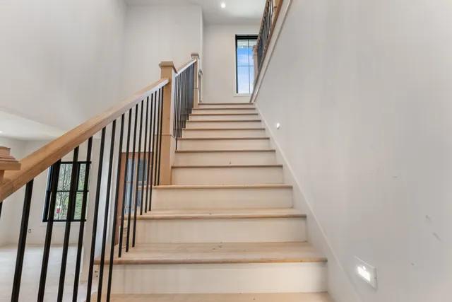 a bathroom with a sink toilet vanity and bathtub