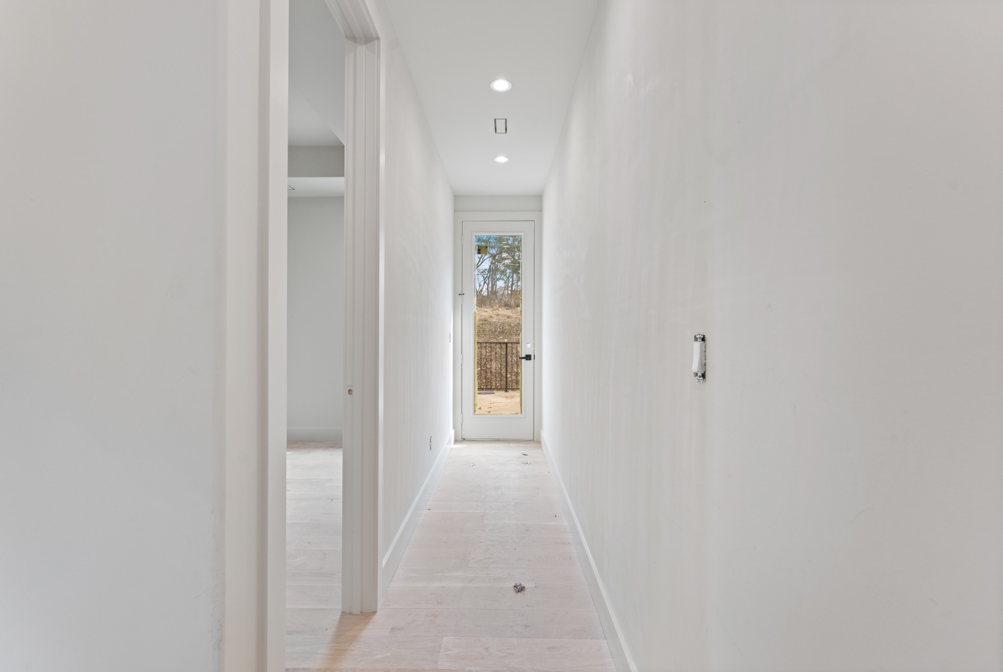 7678 Sawyer Brown Road Nashville, TN 37209 - Photo 41 of 77 a view of a hallway with wooden floor and a bathroom