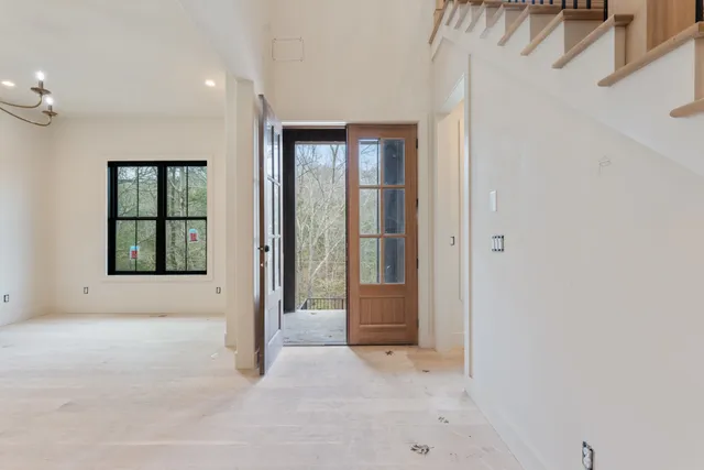 wooden floor in an empty room with a mirror