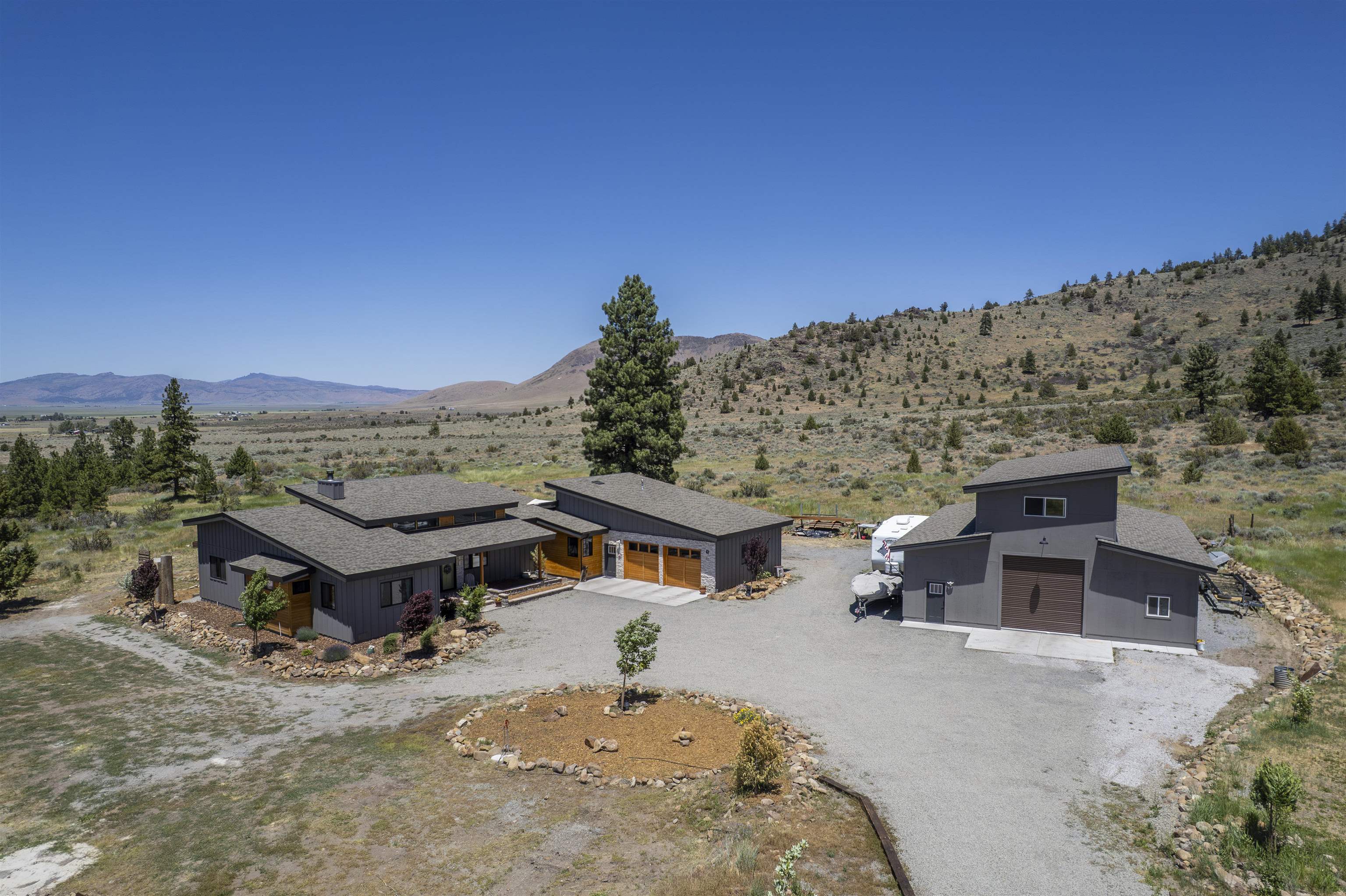134 Smithneck Road Loyalton, CA 96118 - Photo 1 of 26 a aerial view of a house with a yard and mountain view
