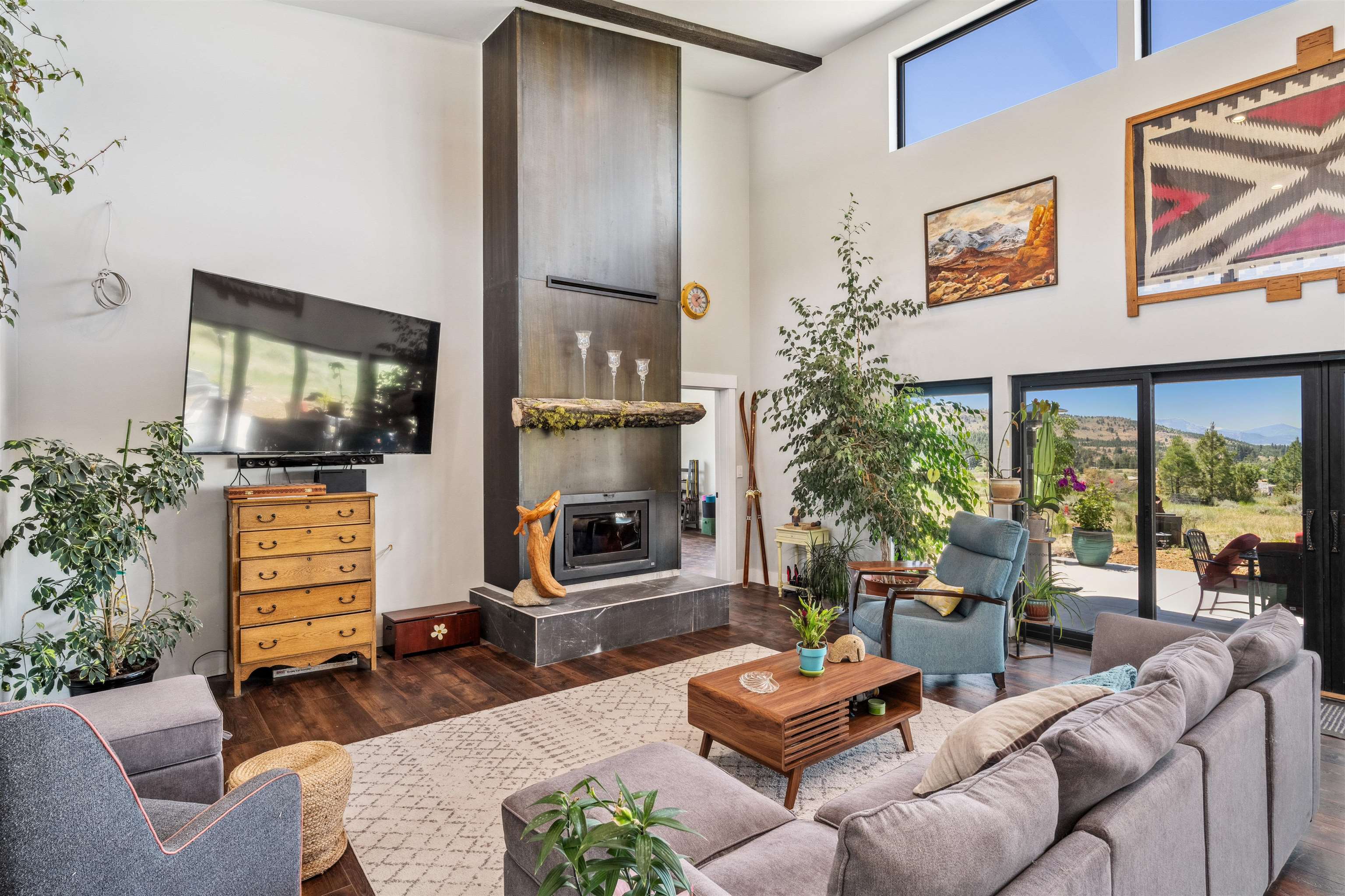 134 Smithneck Road Loyalton, CA 96118 - Photo 6 of 26 a living room with furniture a flat screen tv and a fireplace