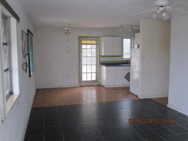 1060 West 3rd Street Riviera Beach, FL 33404 - Photo 2 of 10 a view of an empty room with a window