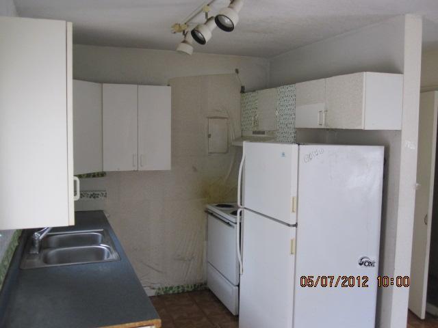 1060 West 3rd Street Riviera Beach, FL 33404 - Photo 4 of 10 a utility room with cabinets washer and dryer