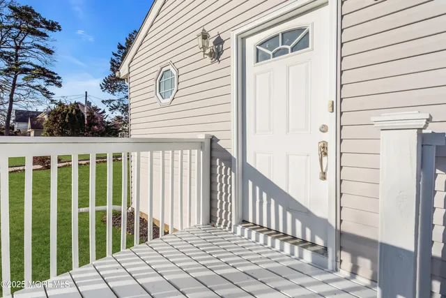 a view of a balcony with wooden floor