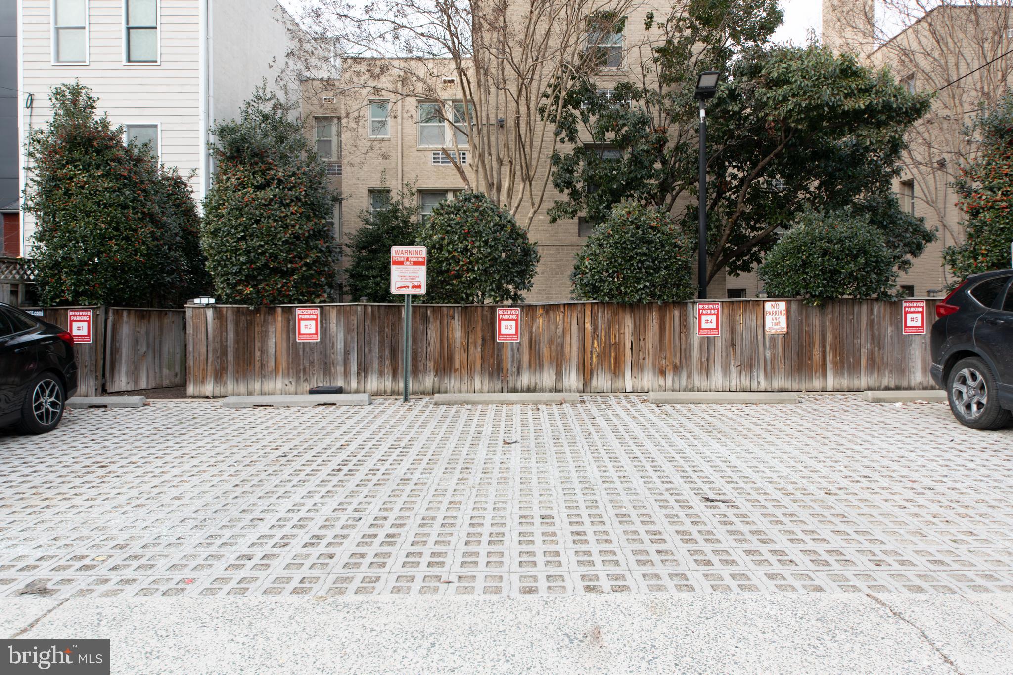 1363 K Street Southeast, Unit 103 Washington, DC 20003 - Photo 13 of 19 a street view with wooden fence and trees