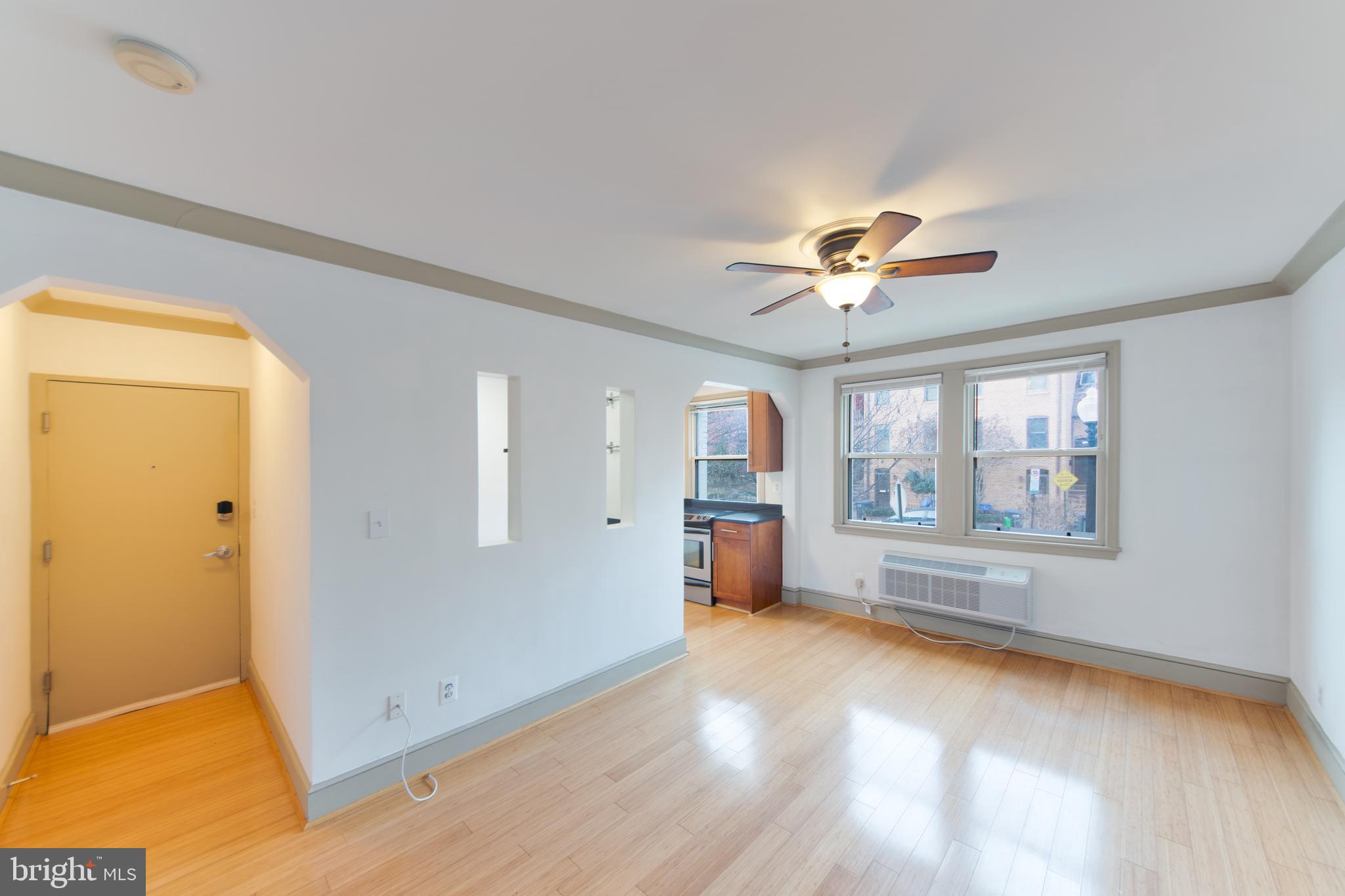 1363 K Street Southeast, Unit 103 Washington, DC 20003 - Photo 4 of 19 a view of an empty room with a window