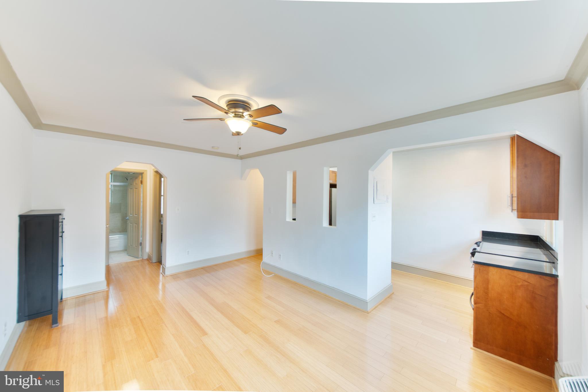 1363 K Street Southeast, Unit 103 Washington, DC 20003 - Photo 5 of 19 a view of a kitchen with wooden floor