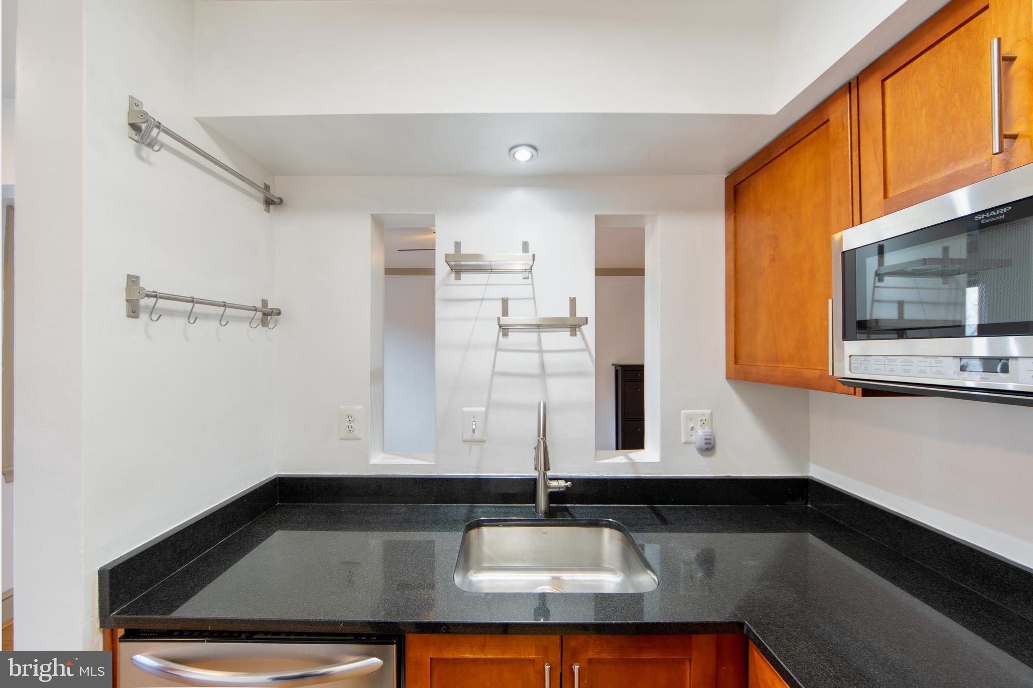 1363 K Street Southeast, Unit 103 Washington, DC 20003 - Photo 7 of 19 a bathroom with a sink and a mirror