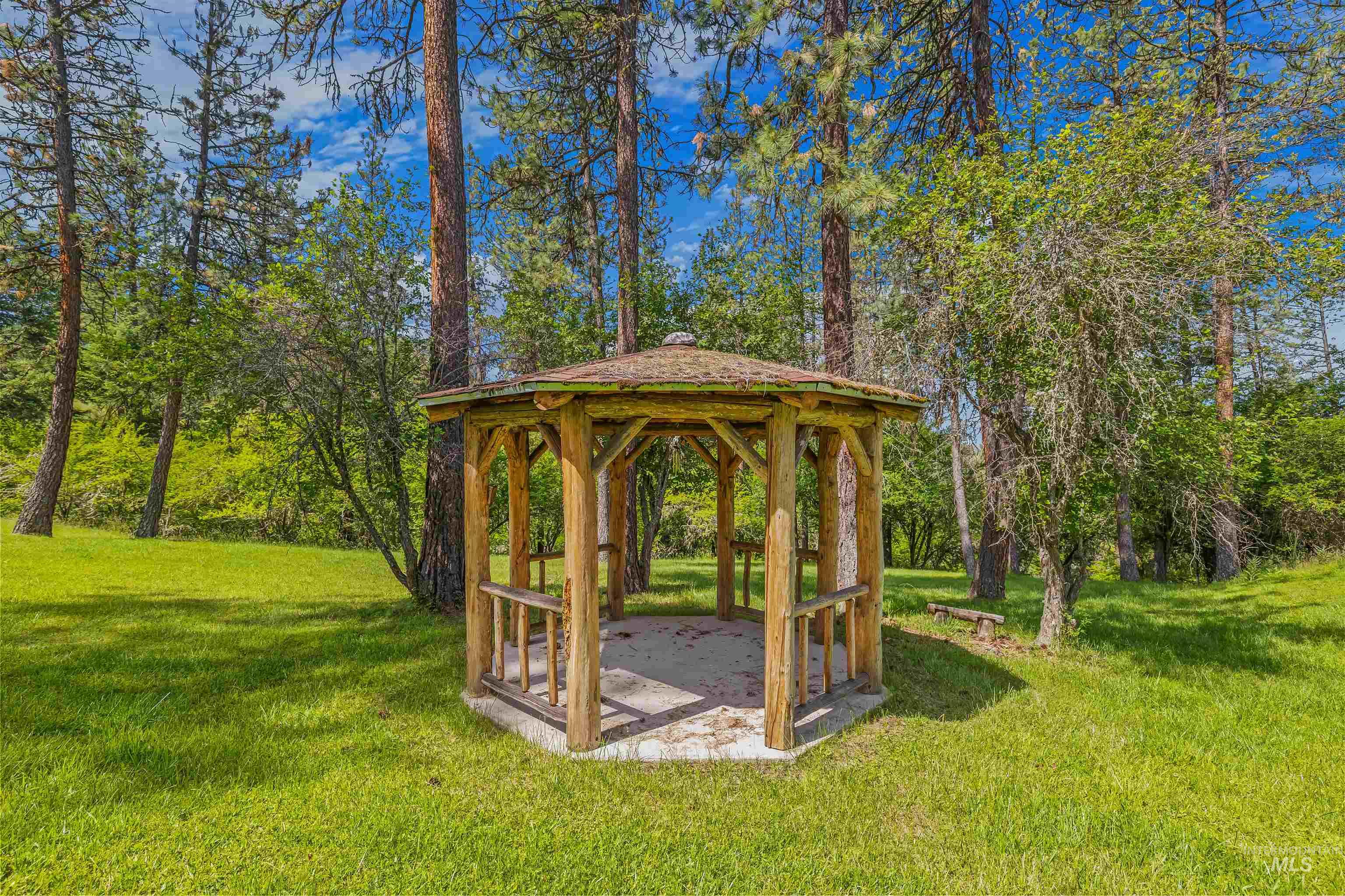 743 Wall Crk Road Stites, ID 83552 - Photo 17 of 48 Wood-frame gazebo with a shingled roof, featuring a concrete base