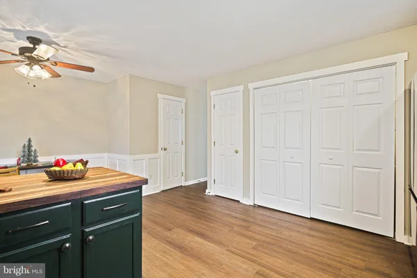a room with wooden floor and closet