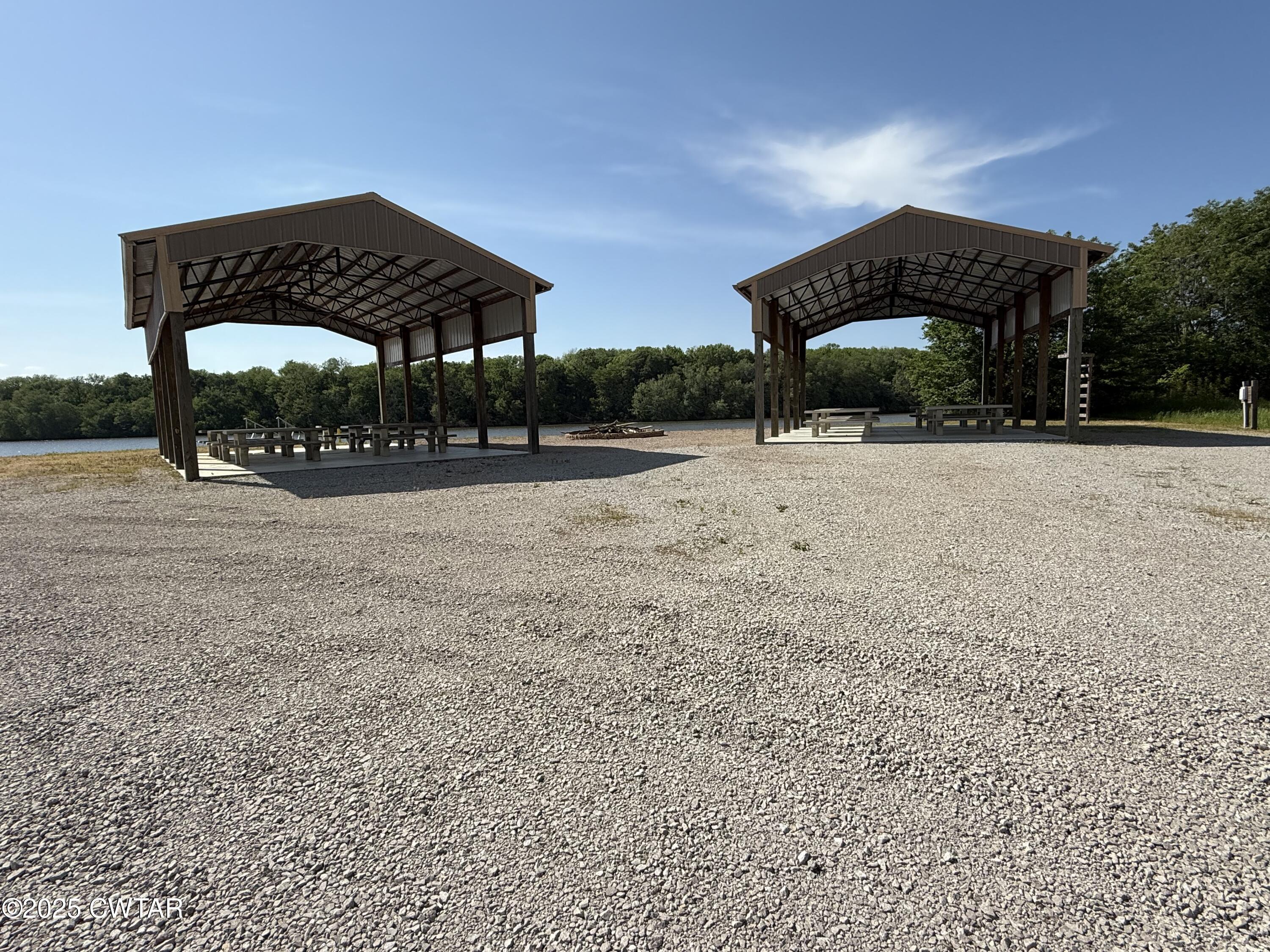 2857 Hardin Bottom River Road Clifton, TN 38425 - Photo 11 of 12 a table and chairs under an umbrella