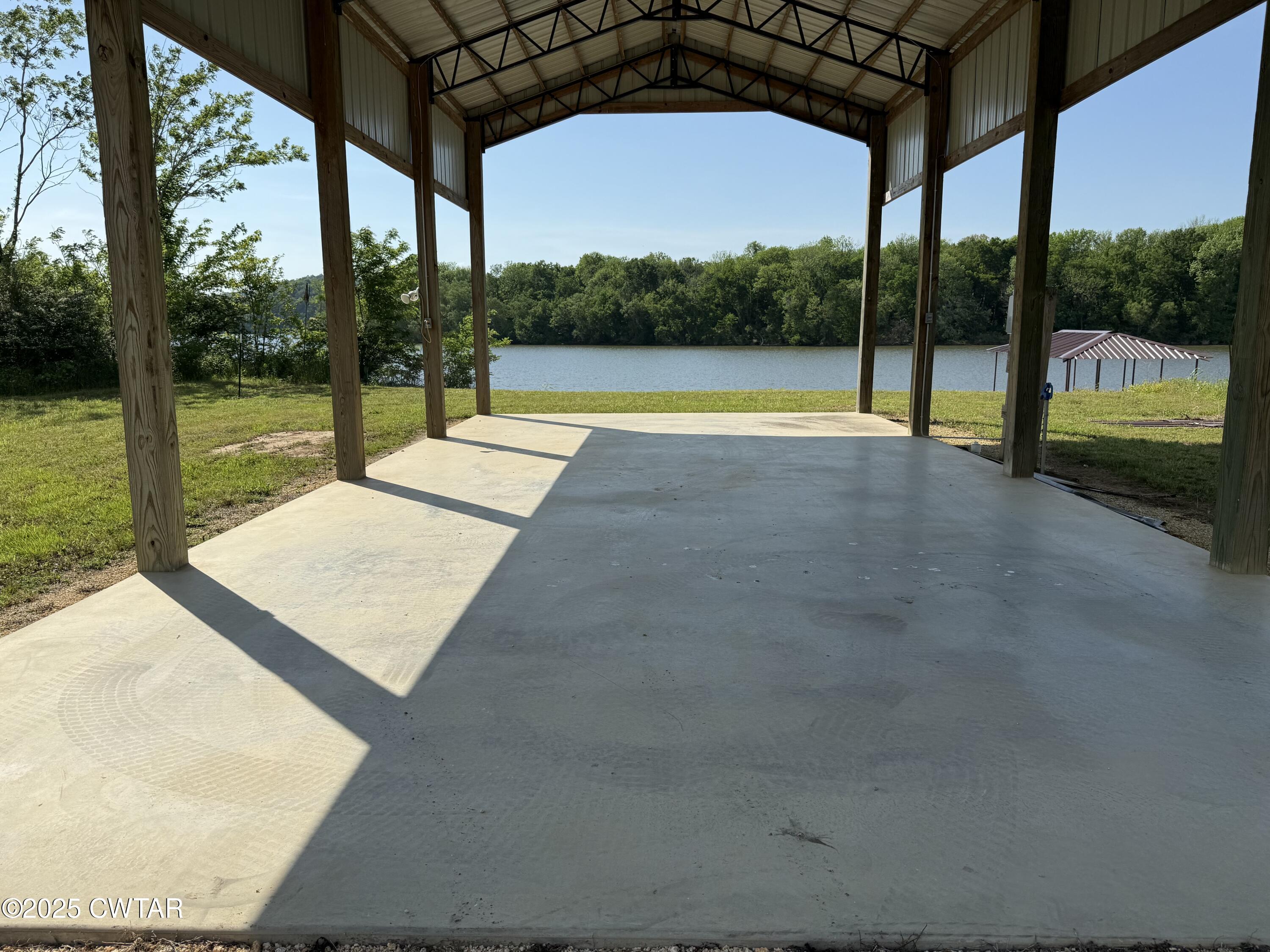 2857 Hardin Bottom River Road Clifton, TN 38425 - Photo 3 of 12 a view of a park with porch and garden