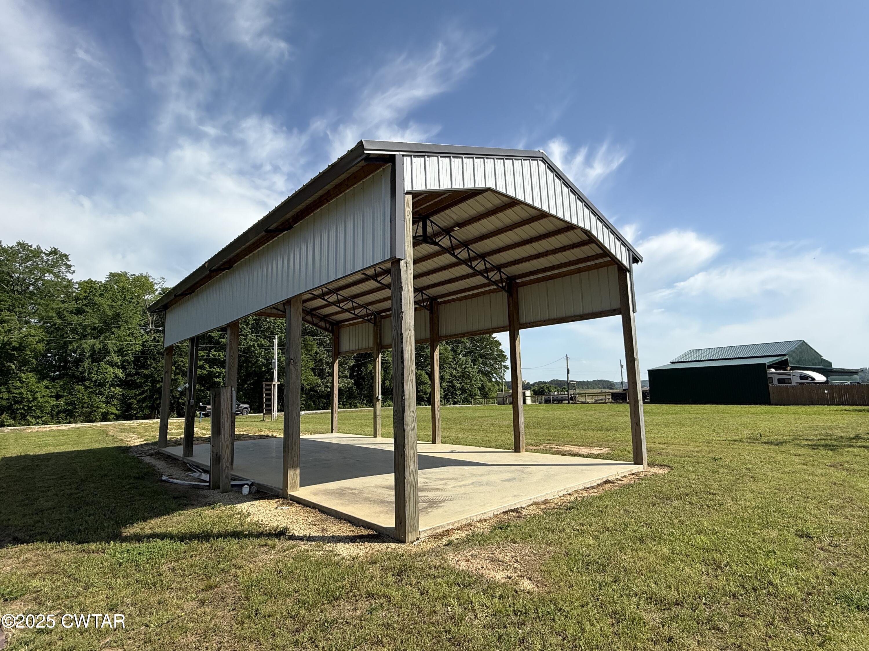 2857 Hardin Bottom River Road Clifton, TN 38425 - Photo 4 of 12 a view of a house with a backyard