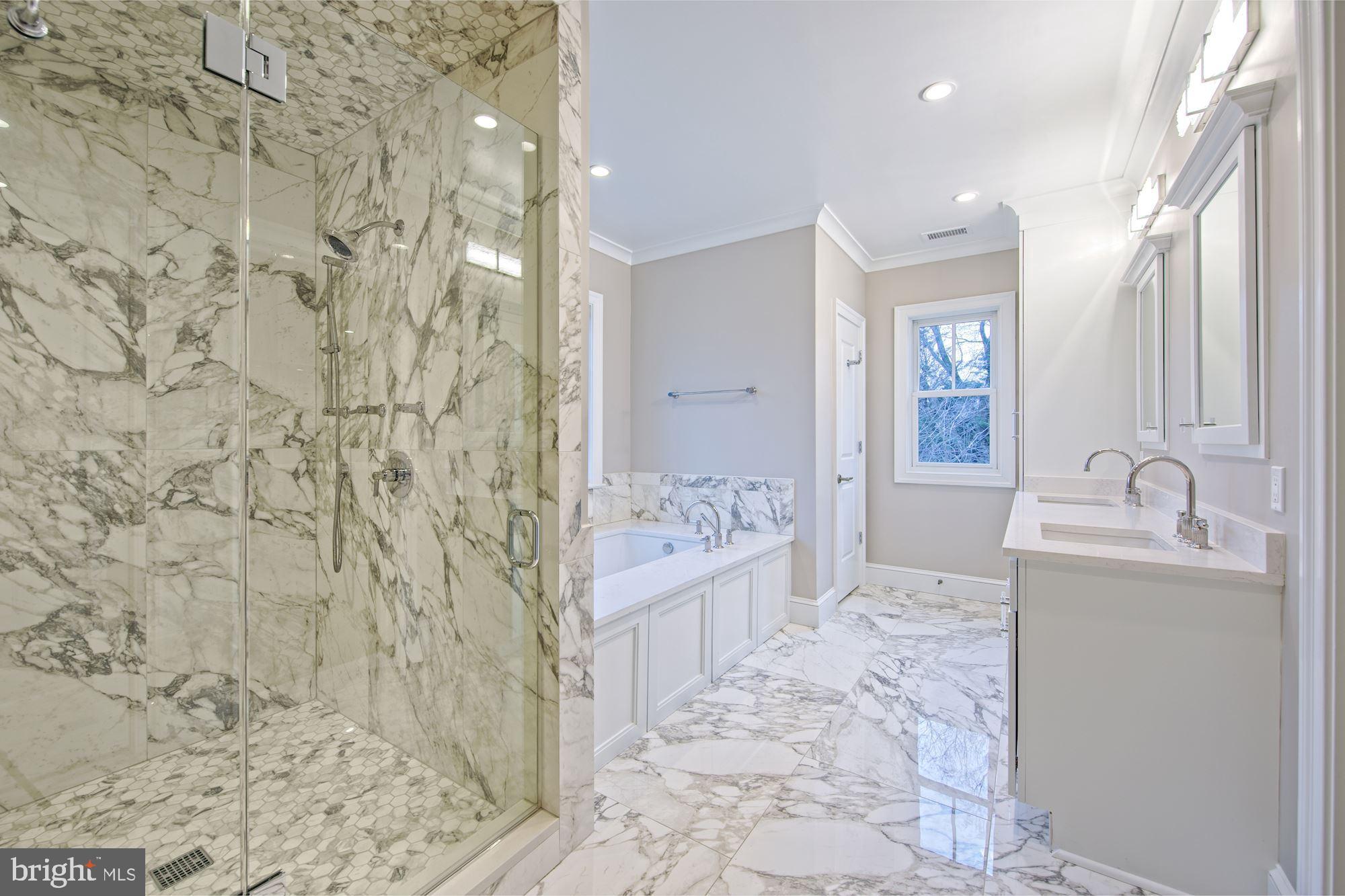 5400 Cathedral Avenue Northwest Washington, DC 20016 - Photo 12 of 17 Marble-clad bath with soaking tub beautiful showe