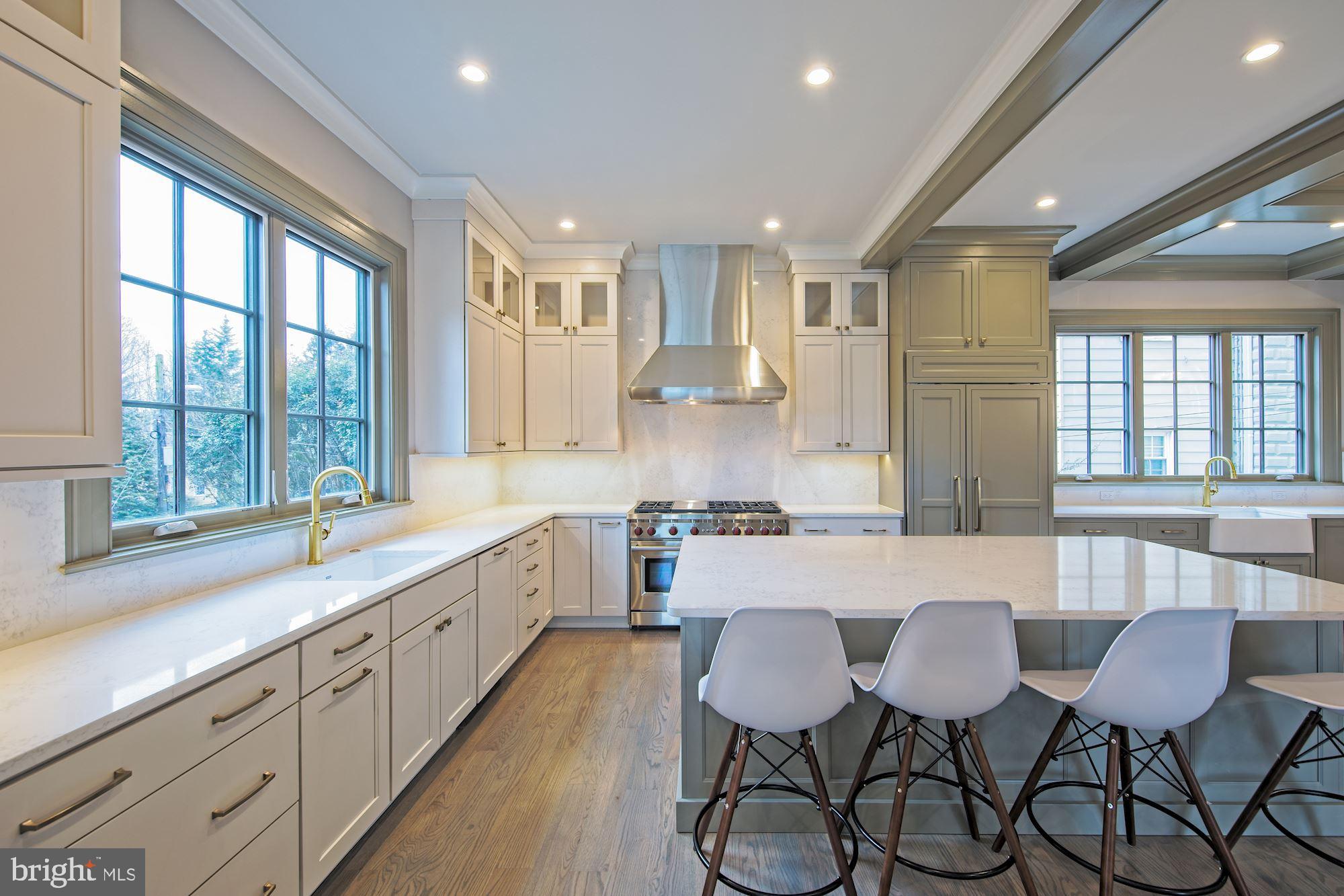 5400 Cathedral Avenue Northwest Washington, DC 20016 - Photo 7 of 17 Brushed-brass hardware on custom cabinetry