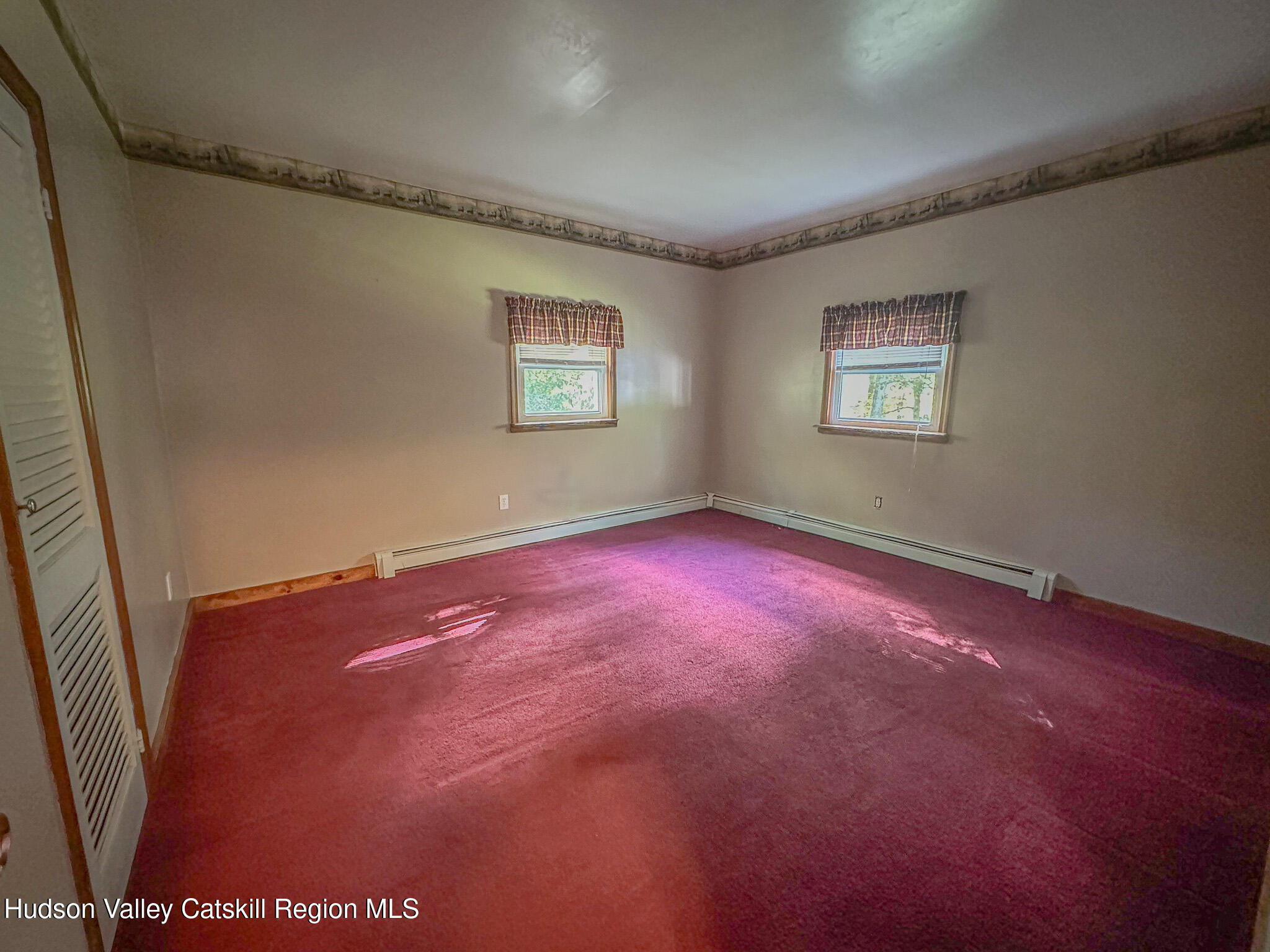 317 Scutt Road Greenville, NY 12083 - Photo 12 of 25 an empty room with windows