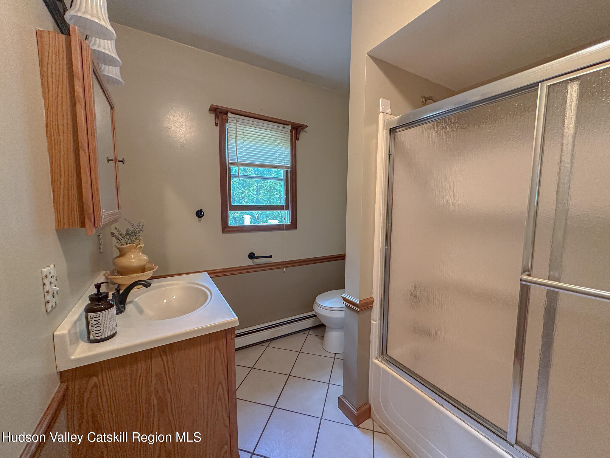 317 Scutt Road Greenville, NY 12083 - Photo 14 of 25 a bathroom with a sink toilet and shower