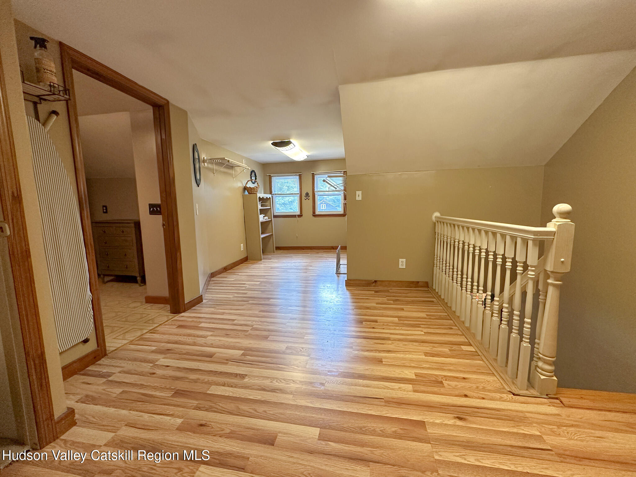 317 Scutt Road Greenville, NY 12083 - Photo 16 of 25 a view of a hallway with wooden floor and staircase