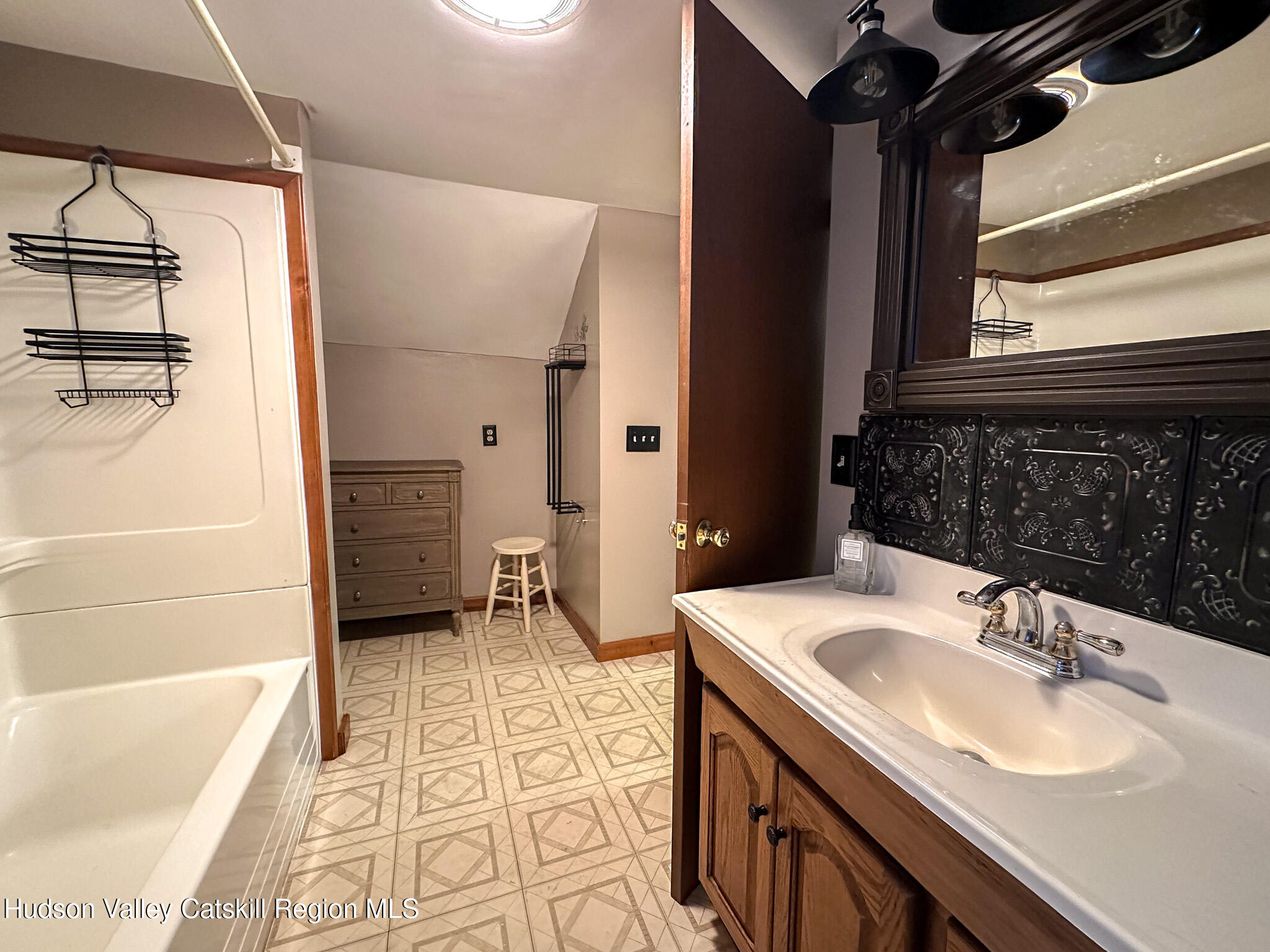 317 Scutt Road Greenville, NY 12083 - Photo 17 of 25 a bathroom with a sink and a bathtub