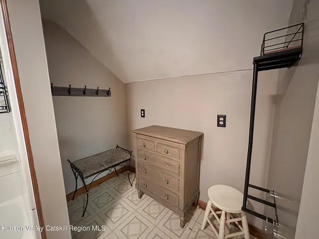 a bathroom with a toilet a sink and a mirror