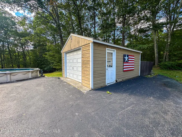 a view of backyard and tree
