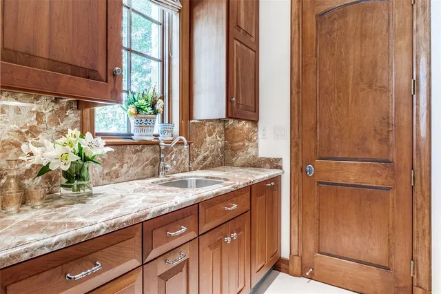 a kitchen with stainless steel appliances granite countertop a stove and a refrigerator