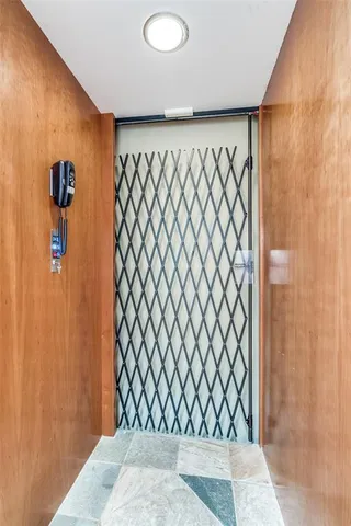 a view of a workspace with furniture and wooden floor