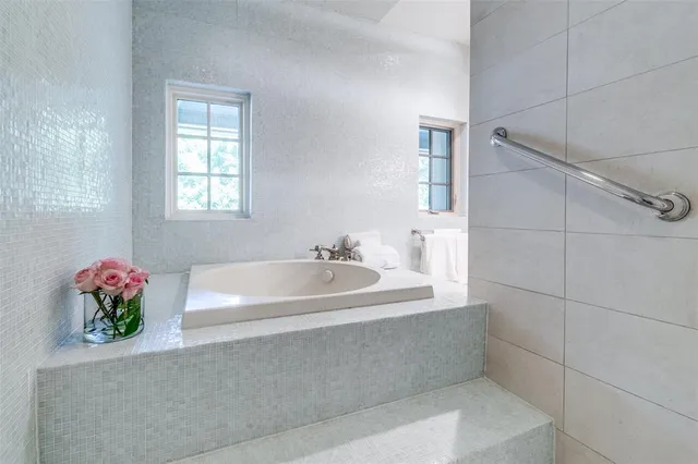 a kitchen with cabinets appliances and a counter space