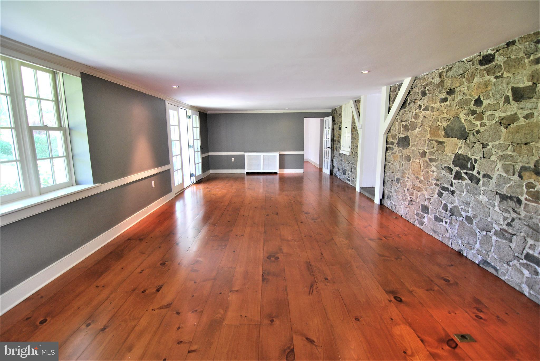 367 Pineville Road Newtown, PA 18940 - Photo 19 of 43 Gathering Room/ Family Room with Stone Wall!