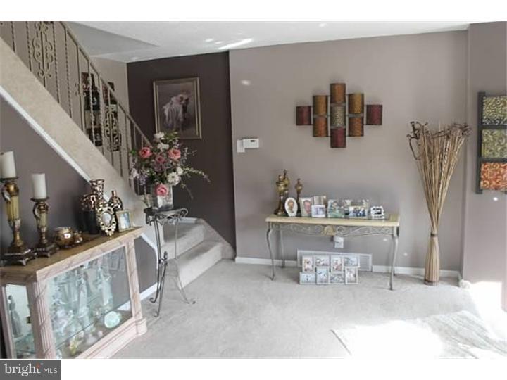 12516 Calpine Road Philadelphia, PA 19154 - Photo 3 of 22 a living room with furniture and a flat screen tv