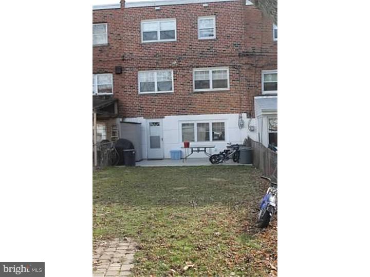 12516 Calpine Road Philadelphia, PA 19154 - Photo 22 of 22 a view of a yard with brick wall and a table