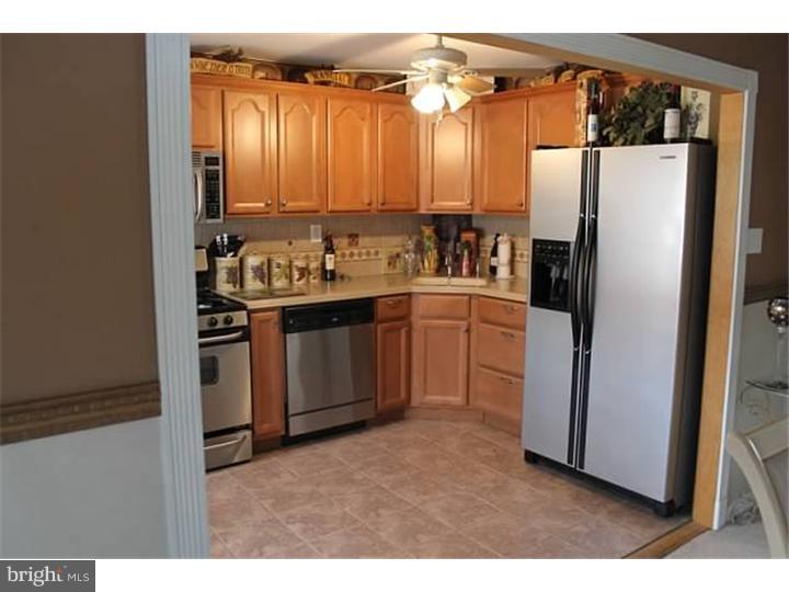 12516 Calpine Road Philadelphia, PA 19154 - Photo 7 of 22 a kitchen with a refrigerator and a sink