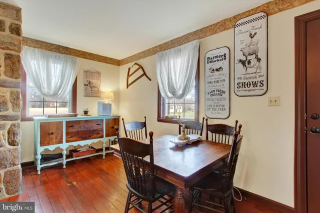 a living room filled with furniture and a large window