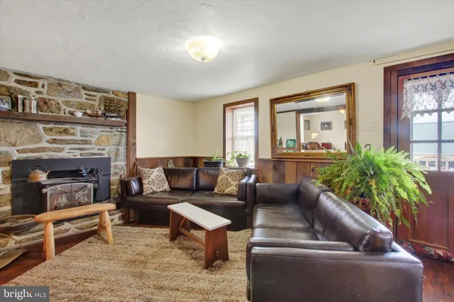 a white toilet sitting next to a shower curtain