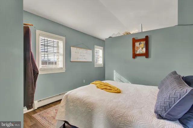 a view of a livingroom with furniture and a workspace
